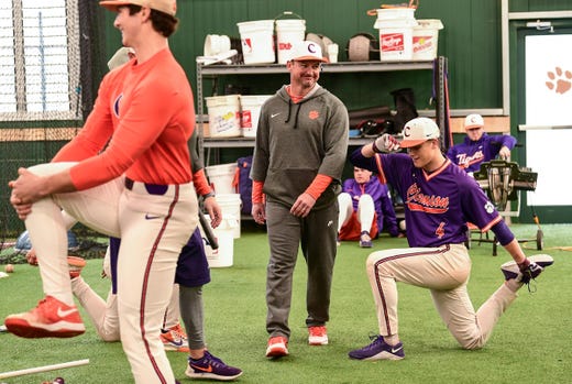 Clemson head coach Monte Lee walks around players during the first official team Spring practice at Doug Kingsmore Stadium in Clemson Friday, January 24, 2020.