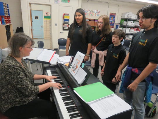 Teacher Edie Taylor plays the keyboard while a few of the members of the Cedar Bluff Middle School’s vocal ensemble choir practice on Jan. 22, 2020, From left are Noor Alsaadun, Ari Rathe, Solomon Murakami, and Allan Rodriguez.