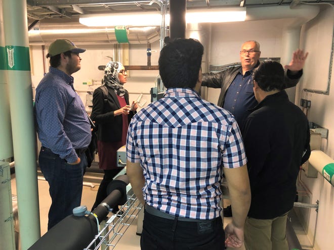 Per Rosen, Ectogrid, showing equipment to an NMSU engineering student team in a mechanical room at Medicon Village, a prototype community that uses a small thermal grid for electrical power.
