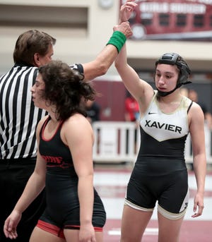 Xavier's Ellisa Jimenez defeated Palm Springs' Alice Sanchez during the Desert Empire League wrestling finals in Rancho Mirage, Calif., on Saturday, January 25, 2020. 