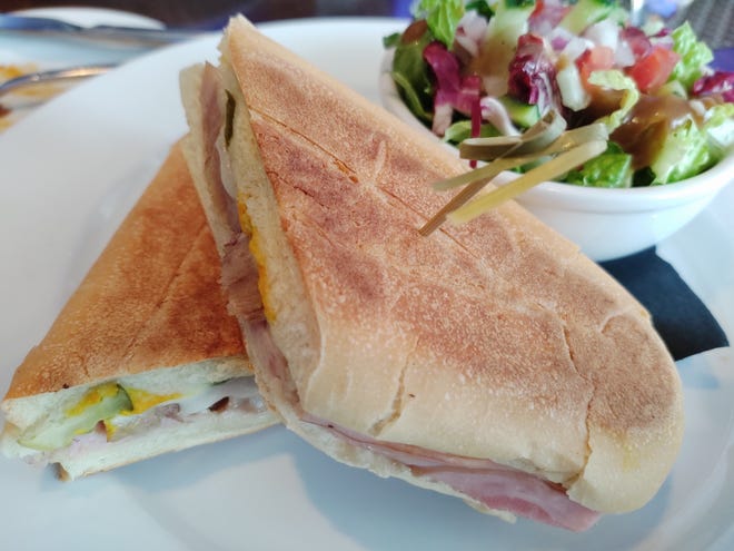 The Wave Kitchen and Bar in Vero Beach, owned by Gloria Estefan, features some Cuban dishes on its diverse menu, including this traditional Cuban sandwich with roasted pork, ham and Swiss cheese with pickles and mustard pressed between Cuban bread.