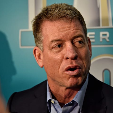 Fox Sports broadcaster Troy Aikman speaks with the