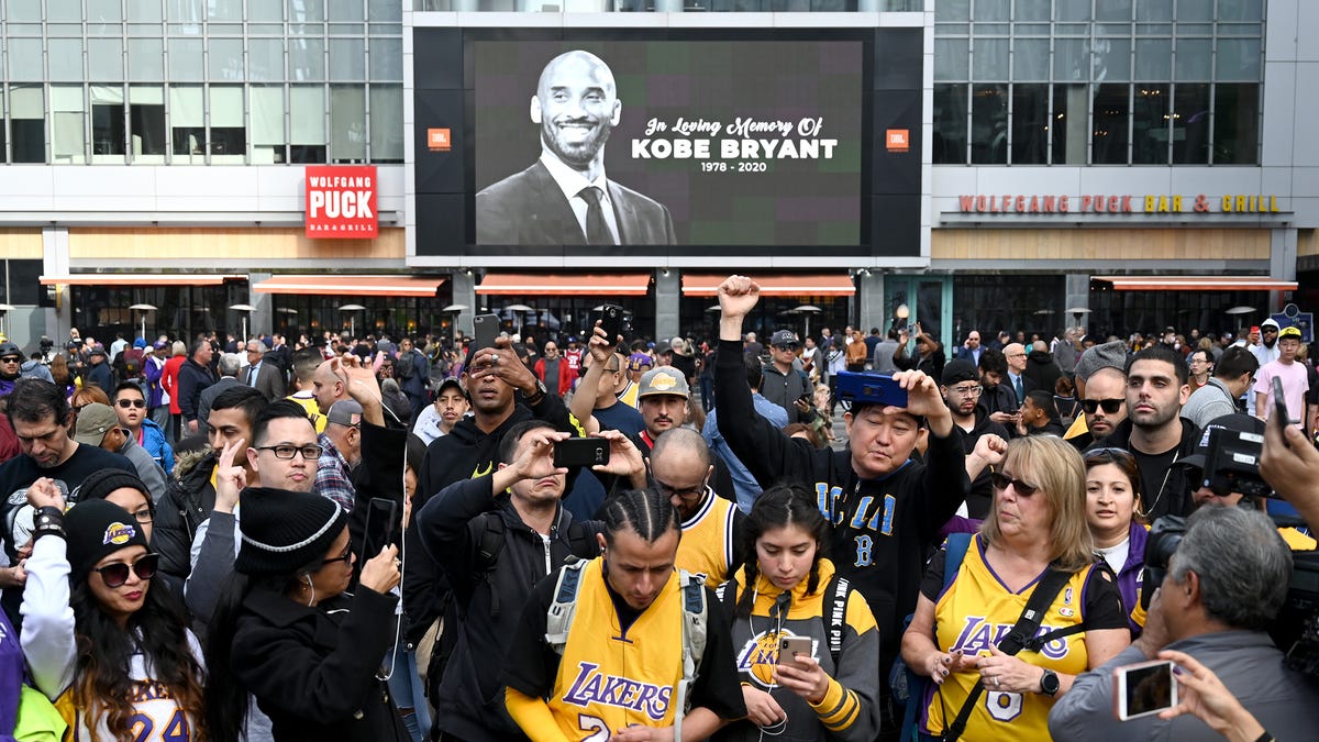 Fans gather outside Staples Center to pay tribute to the late Kobe Bryant.
