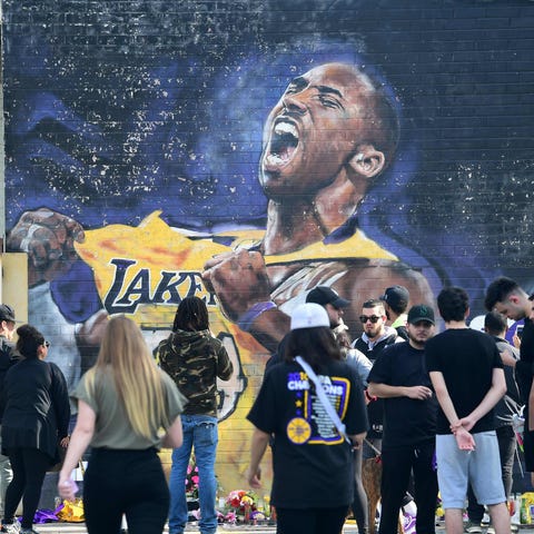 Fans gather to mourn the death of NBA legend Kobe 