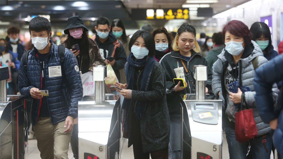 People wear masks at a metro station in Taipei, Taiwan, on Tuesday, Jan. 28. According to the Taiwan Centers of Disease Control (CDC) Tuesday, the eighth case diagnosed with the 2019 novel coronavirus has been confirmed in Taiwan.