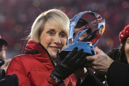 Kansas City Chiefs owner Norma Hunt, the widow of the founder of the American Football League, holds the Lamar Hunt trophy.