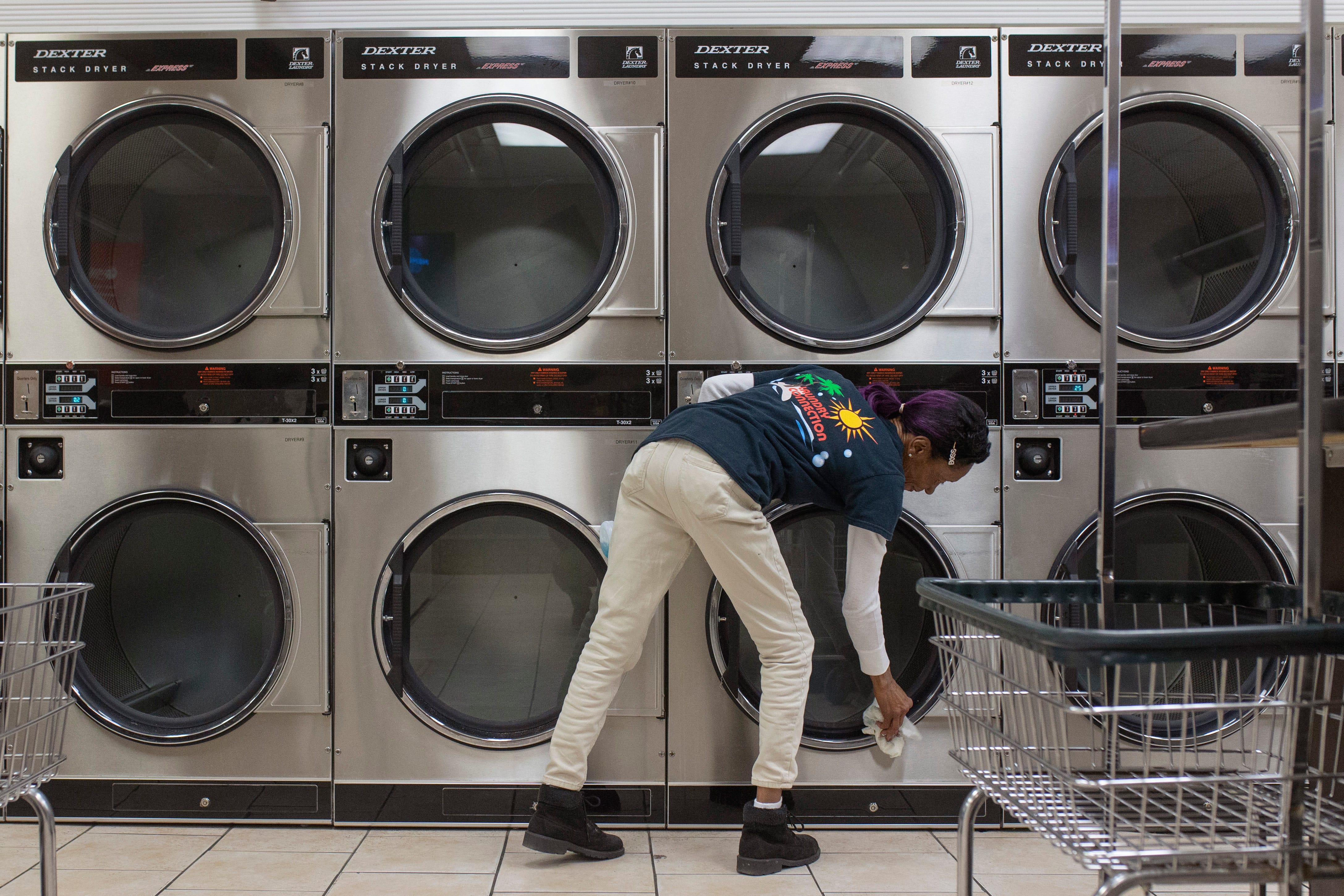 11:09 PM

"Miss" Margaret Shemwell works on cleaning up the dryers at Laundry Connection on Southgate Avenue just after closing on Jan. 16, 2020. "I love what I do, because I just love cleaning," Shemwell, who has worked in laundromats for nine years, said.