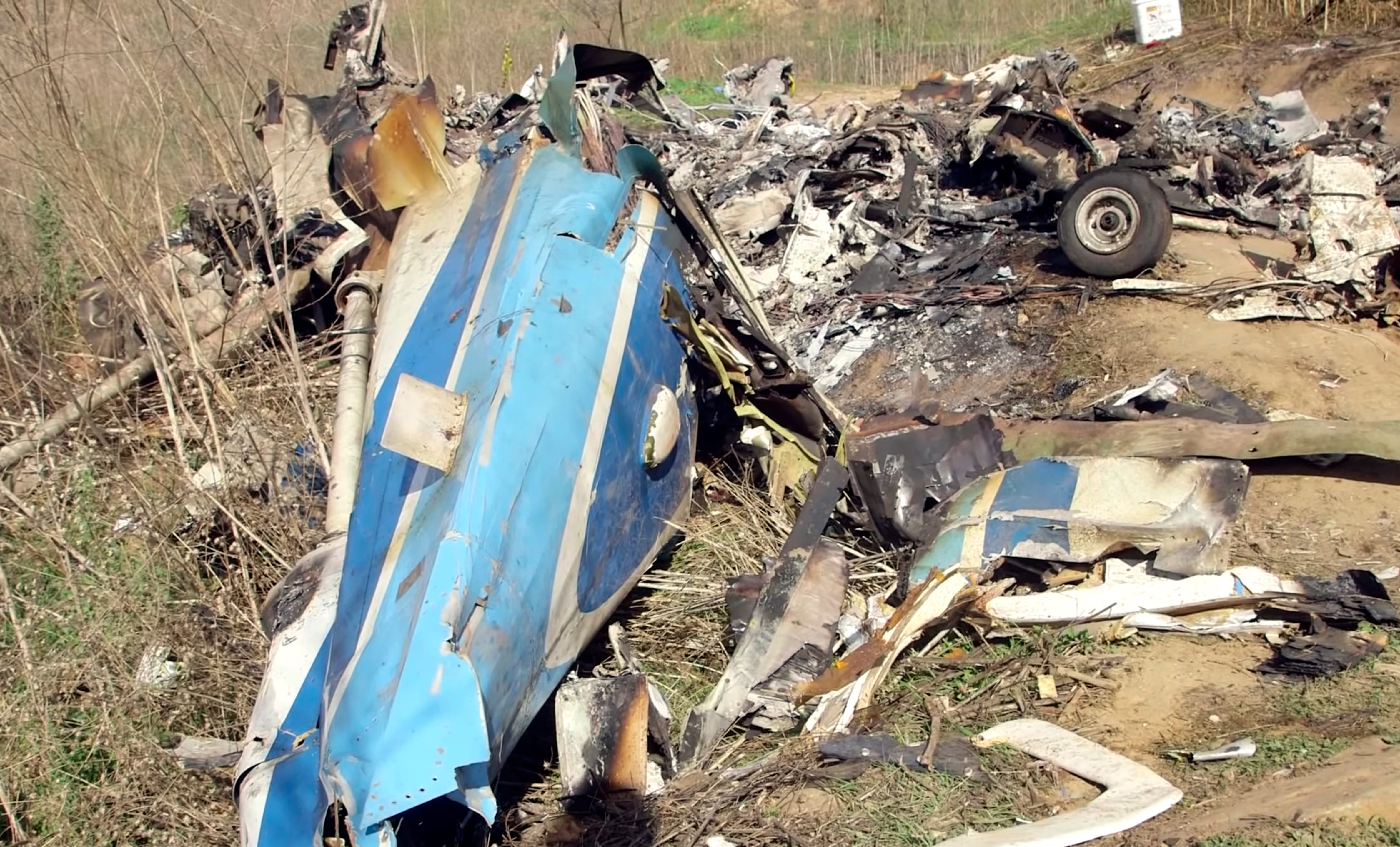 This image taken from video on Monday, Jan. 27, 2020, and provided by the National Transportation Safety Board, shows part of the wreckage of a helicopter crash near Calabasas, Calif. The Sunday, Jan. 26 crash killed former NBA basketball player Kobe Bryant, his 13-year-old daughter, Gianna, and seven others. (James Anderson/National Transportation Safety Board via AP) ORG XMIT: NYDD306