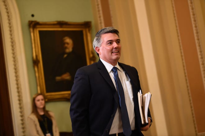 Sen. Cory Gardner, R-Colo., walks outside the Senate chamber during a recess in the impeachment trial against President Donald Trump on Tuesday.