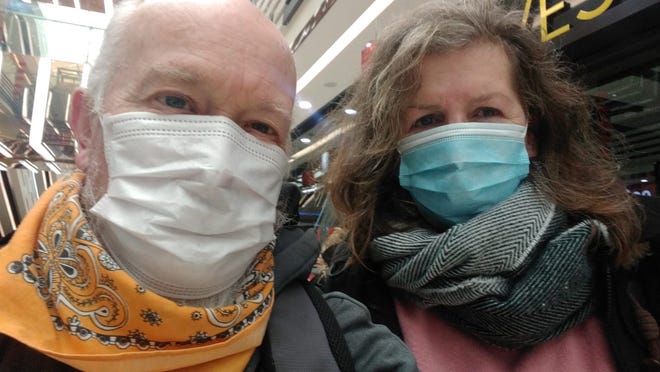 Teachers John McGory and Liz Jones wear masks in Wuhan, China on Jan. 25, 2020.