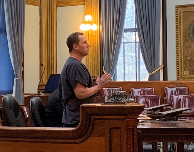 Nicholas Huffman raises his hand to be placed under oath for a change of plea and sentencing hearing in Licking County Common Pleas Court on Thursday, Jan. 30, 2020. Huffman pleaded guilty to felonious assault and abduction, resulting in a six to eight year prison sentence.