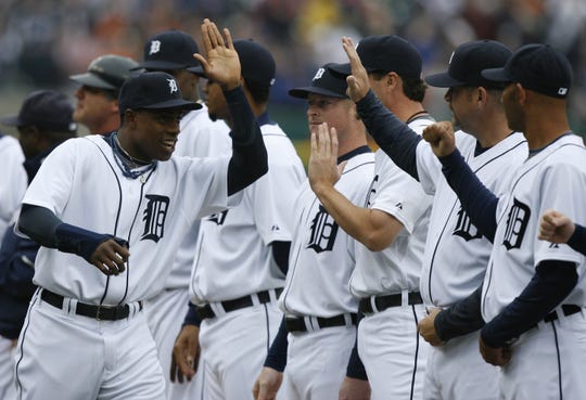 An injured Curtis Granderson greets his teammates during player introductions prior to the start of play  against the Kansas City Royals on Opening Day in 2008.