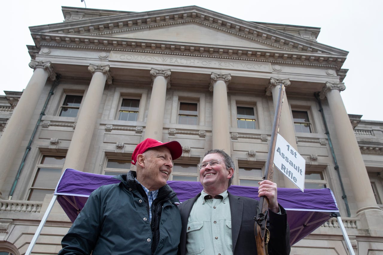 Gun rights advocate Dick Heller, left, and Kentucky U.S. representative, Thomas Massie, get the crowd fired up during a second amendment rally in Frankfort, Ky. on Friday. Jan. 31, 2020