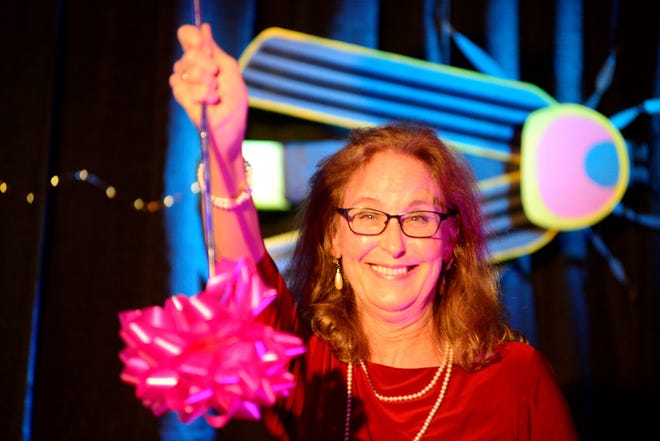 Betty Preston twirls a baton after winning the 2019 Chairman's Award during Richland Area Chamber and Economic Development's annual meeting.
