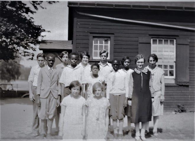 Built in 1830, the Little Red Schoolhouse in Fishkill operated for 129 years on the southeast corner of today's Route 9D and Red Schoolhouse Road. Elizabeth Livingston Travis, far right, taught grades 1 to 8 in the one-room structure for 47 years.