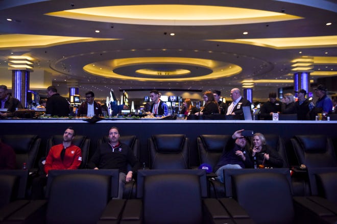 People watch tv on the large screens during the opening of Betfred sportsbook on Thursday, Jan. 30, 2020 at Grand Falls Casino in Larchwood, Iowa. 