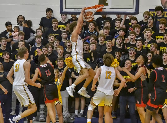 Max Land of Moeller dunks the ball against La Salle at Moeller High School, Friday, Jan. 31, 2020