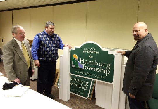Hamburg Township Clerk Jim Neilson (left), Trustee Mike Dolan (center) and real estate agent Rick Beaudin (right) discuss the importance of identifying Hamburg Township as a community Jan. 19, 2016. Neilson passed away on Monday Feb. 3, 2020 after battling amyotrophic lateral sclerosis, or ALS. Neilson also served for several years as the township's clerk.