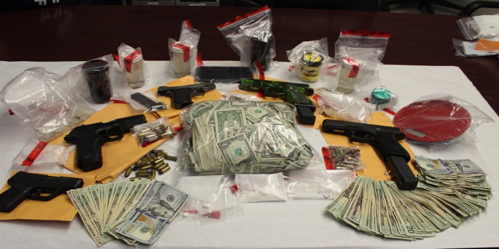 Guns, drugs and a bag of cash seized by ECSO from Pensacola home