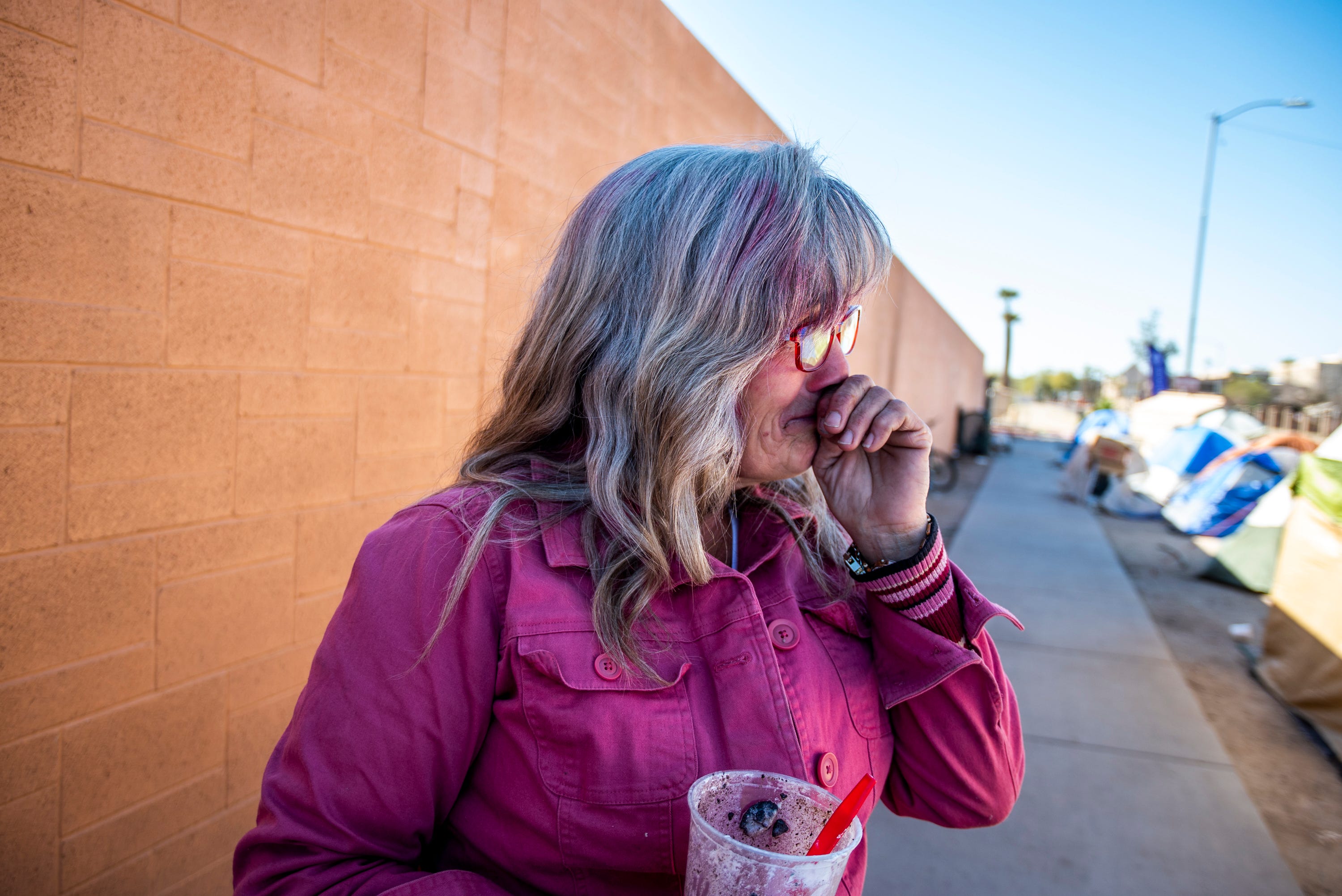 Darlene Carchedi gets emotional  on Feb. 4, 2020, after CASS employees help her with the upcoming encampment cleanup in Phoenix.