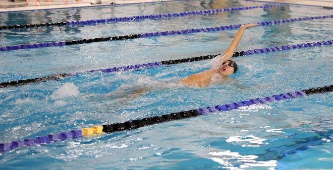 Wappingers boys swimming standout Sebastian Smith, photographed in 2019, is performing a backstroke. He has qualified for several individual events in the 2022 state tournament.
