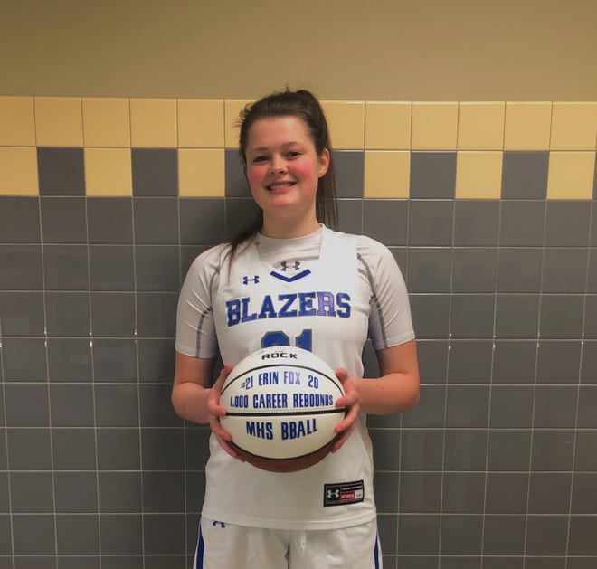 Erin Fox poses with her commemorative 1,000 rebound basketball after the senior reached the milestone in leading Millbrook over Rondout Valley on Feb. 3.