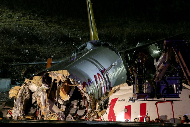 A picture shows a the crash site of a Pegasus Airlines Boeing 737 airplane, after it skidded off the runway upon landing at Sabiha Gokcen airport in Istanbul on Feb. 5, 2020.