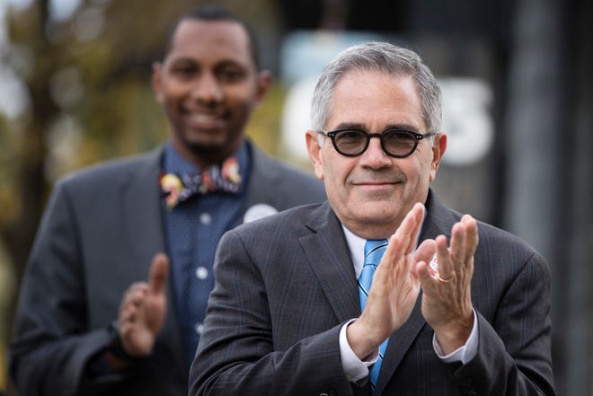 Philadelphia district attorney Larry Krasner, shown here in 2017 as he heads to the polls, has drawn the fire of President Donald Trump and police unions who accuse the reform-oriented DA of being soft on crime.