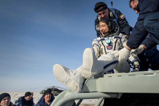NASA astronaut Christina Koch is helped out of the Soyuz MS-13 spacecraft Thursday just minutes after she, Roscosmos cosmonaut Alexander Skvortsov, and ESA astronaut Luca Parmitano, landed their Soyuz MS-13 capsule in a remote area in Kazakhstan. Koch returned to Earth after logging 328 days in space, the longest spaceflight in history by a woman.