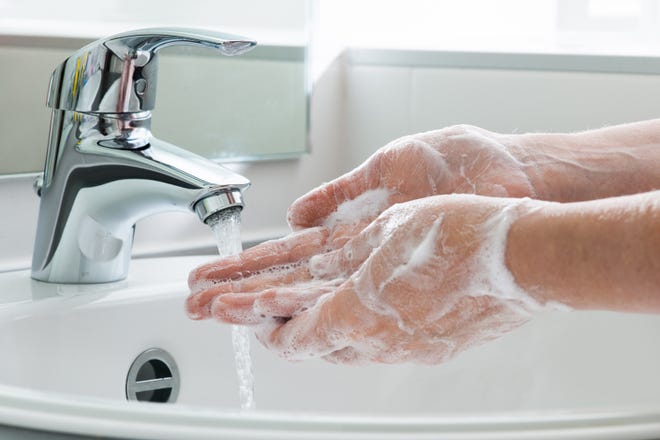 Wash your hands, vigorously, with soap and water for at least 20 seconds