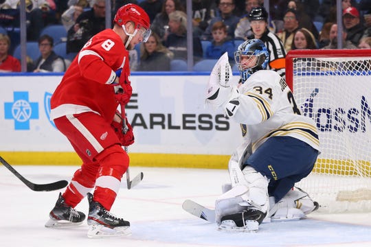 Buffalo Sabres goalie Jonas Johansson (34) stops Detroit Red Wings forward Justin Abdelkader (8) during the second period.