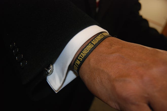 Arnold Cifax wore a wristband announcing that he stands against human trafficking during the Nov. 25 kickoff of HEMAD's 2019 campaign.