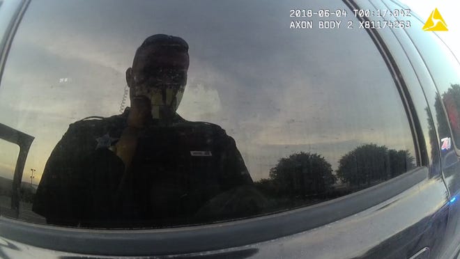 Former Jackson County, Florida, Deputy Zachary Wester's reflection seen on his body camera footage.