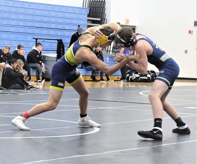 Lancaster junior Jacob Reed wrestles against Teays Valley during Saturday's Division I, Region 6 dual team tournament at Hilliard Darby. Reed picked up his 100th career win.