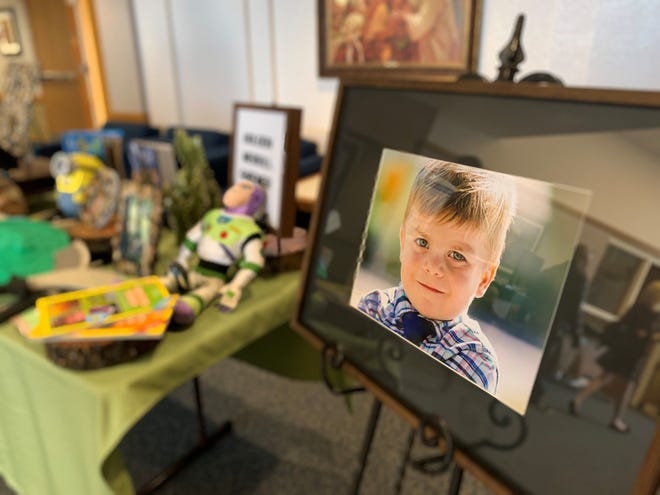 A photo of 6-year-old Holden Gardner, who died Feb. 3 after being hit by a semi-truck, stood at the entrance to Mesa AZ Red Mountain LDS Institute during his funeral service on Feb. 8, 2020.