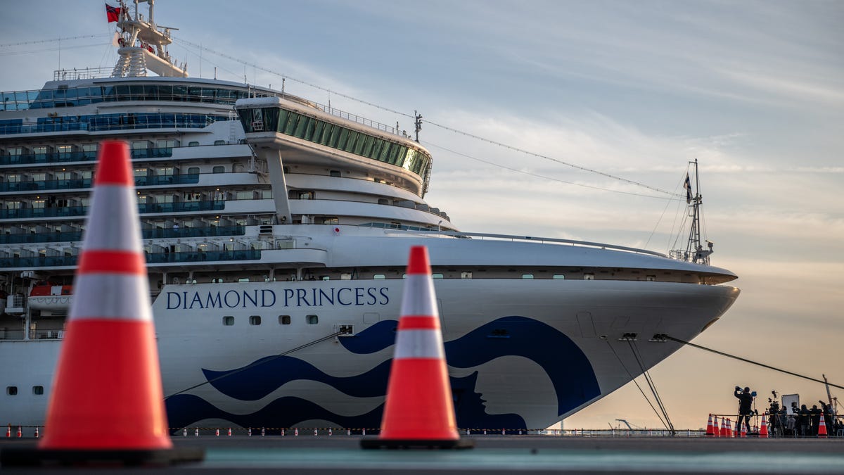 The Diamond Princess cruise ship sits docked at Daikoku Pier where it is being resupplied and newly diagnosed coronavirus cases taken for treatment as it remains in quarantine after some people on board were confirmed to have coronavirus, on February 7, 2020 in Yokohama, Japan.