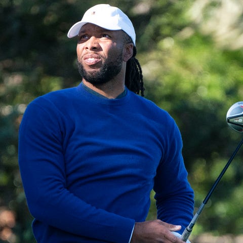Larry Fitzgerald hits his tee shot on the second h