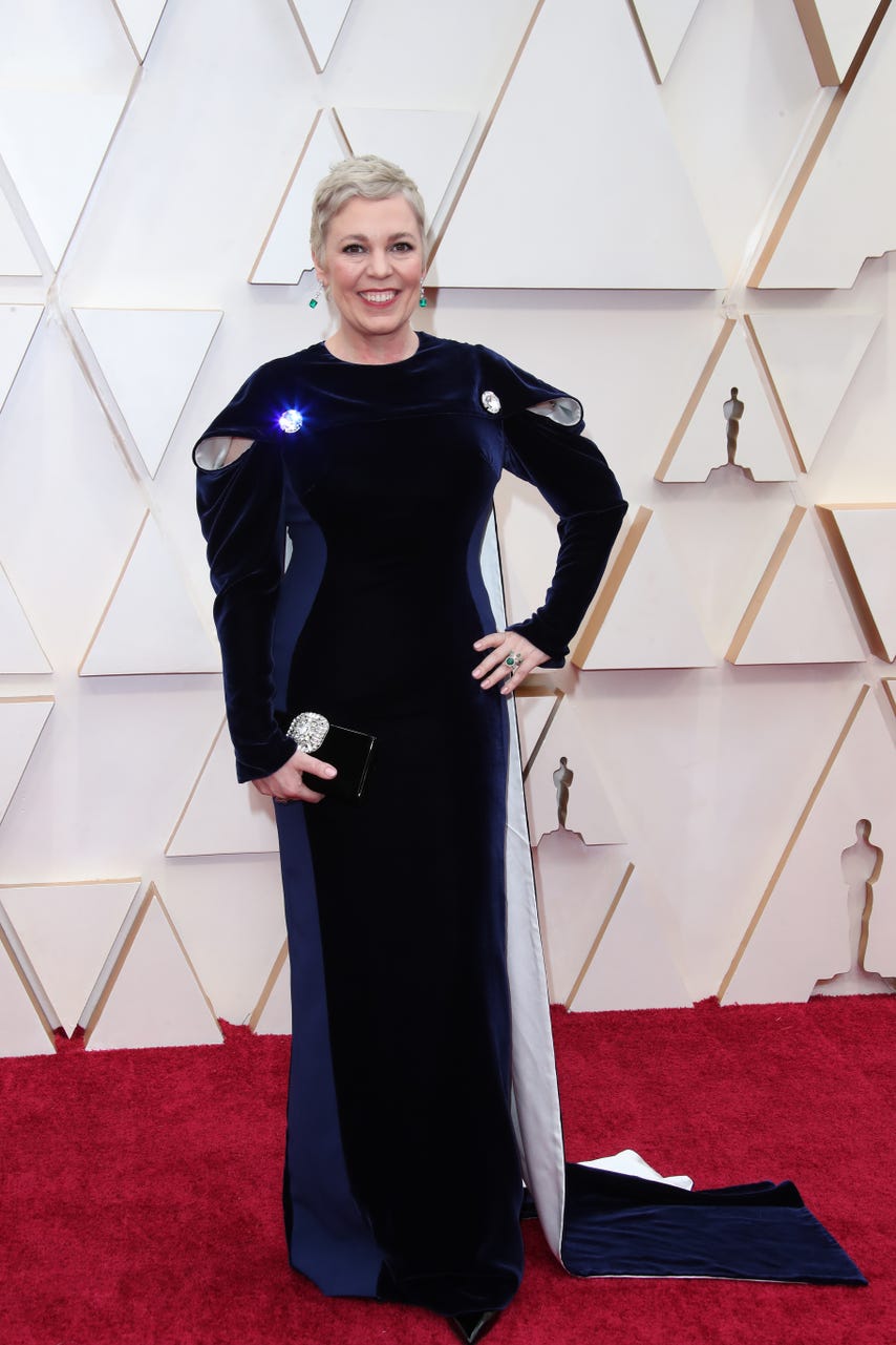 Olivia Colman is an Oscar-winning queen and can wear whatever she wants, even if it’s a Stella McCartney gown with a bifurcated cape and giant crystal appliques that doesn’t make a lick of sense.