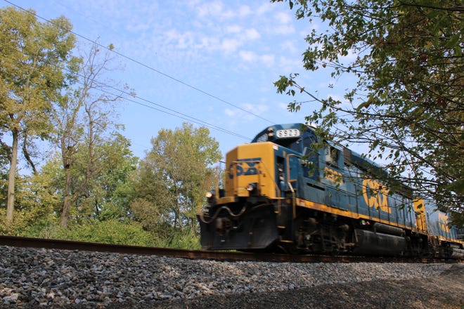 CSX Transportation is investigating what caused eight empty rail cars to derail in Cincinnati Friday night, sending three of them into Mill Creek.