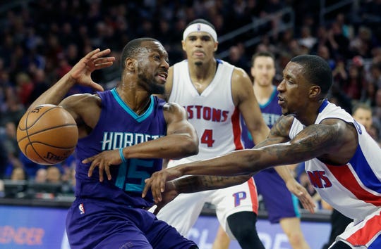 Detroit Pistons guard Kentavious Caldwell-Pope, right, fouls Charlotte Hornets guard Kemba Walker (15) during the second half.