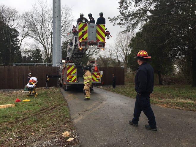 Multiple agencies work to rescue a worker stranded on a cell phone tower in La Vergne on Tuesday morning.