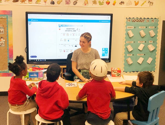 Kelsey Taylor, a special-education teacher, works on a reading comprehension lesson with second-graders at Frye Elementary in Chandler on Tuesday, Feb. 11, 2020.