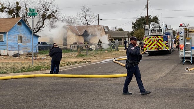 San Angelo firefighters rush to extinguish a blaze in the 1600 block of N. Farr St. Tuesday, Feb. 11, 2020.