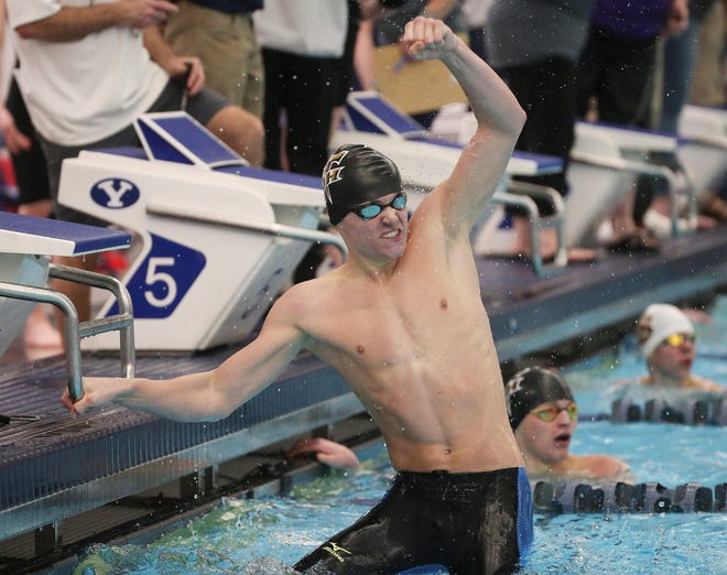 Desert Hills' Ashton Anderson celebrates during the 4A Swimming Championships at BYU.