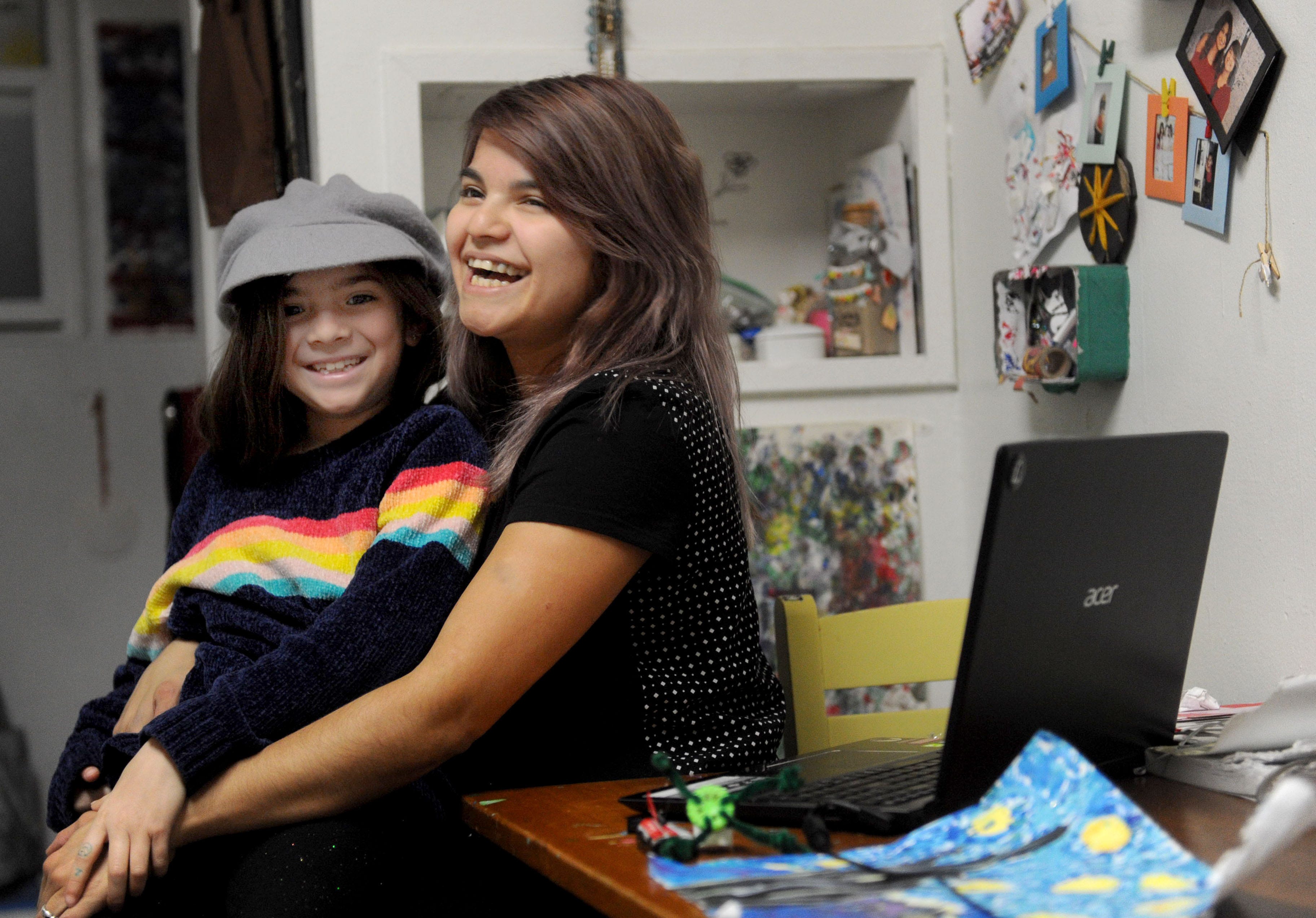 Jessica Quiroz hugs her daughter, Cadence. They have lived at the City Center shelter in Ventura for the past two years.