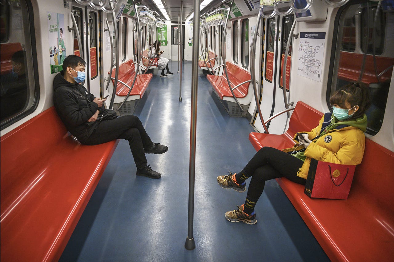 People wear protective masks as they ride on a nearly empty subway car during the evening rush period on Feb. 10, 2020 in Beijing, China. The number of cases of a deadly new coronavirus rose to more than 40000 in mainland China Monday, days after the World Health Organization (WHO) declared the outbreak a global public health emergency. China continued to lock down the city of Wuhan in an effort to contain the spread of the pneumonia-like disease which medicals experts have confirmed can be passed from human to human. In an unprecedented move, Chinese authorities have put travel restrictions on the city which is the epicenter of the virus and municipalities in other parts of the country affecting tens of millions of people. The number of those who have died from the virus in China climbed to over 900 on Monday, mostly in Hubei province, and cases have been reported in other countries including the United States, Canada, Australia, Japan, South Korea, India, the United Kingdom, Germany, France and several others. The World Health Organization has warned all governments to be on alert and screening has been stepped up at airports around the world. Some countries, including the United States, have put restrictions on Chinese travelers entering and advised their citizens against travel to China.