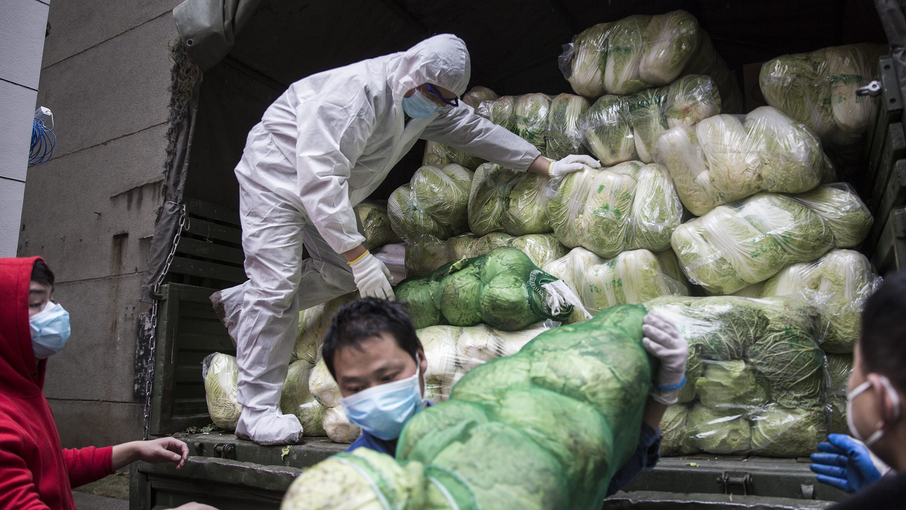Coronavirus cases spike in China; American from Wuhan flight diagnosed