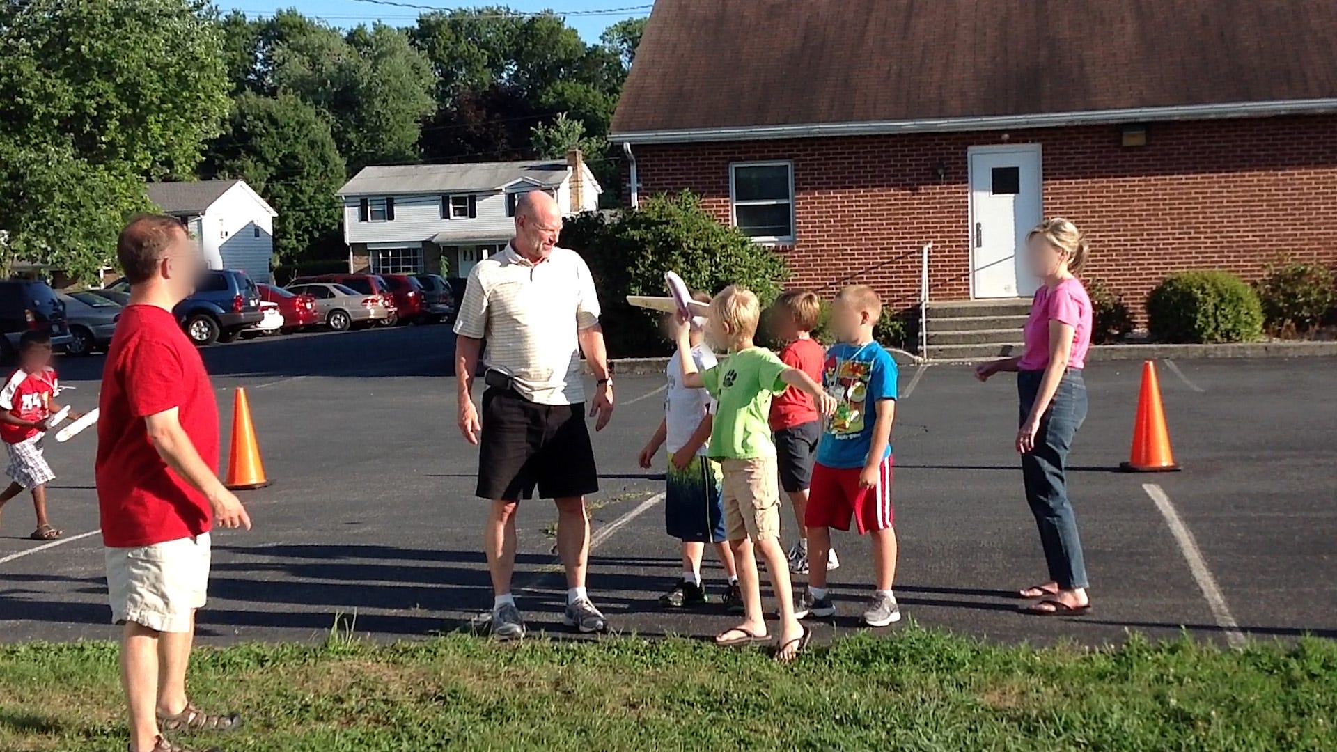 Donald Foose stands among a group of children at Oakwood Baptist Church's Vacation Bible School in 2012. USA TODAY has blurred the faces of some individuals to protect their anonymity.