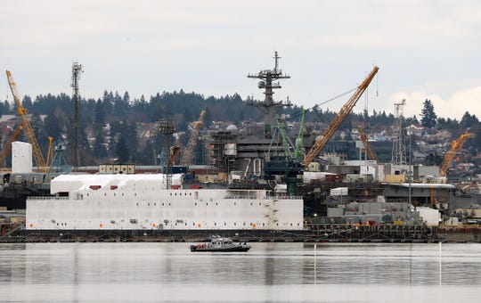 The USS Carl Vinson in dry dock at Puget Sound Naval Shipyard as seen from Port Orchard on Wednesday, Feb. 12. 2020.