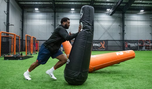 Kendall Coleman, former Cathedral High School and Syracuse University football player, trains for the 2020 NFL Combine alongside pass rush specialist and former Indianapolis Colts defensive end Robert Mathis at Pro X Athlete in Westfield, Ind., on Tuesday, Feb. 11, 2020.
